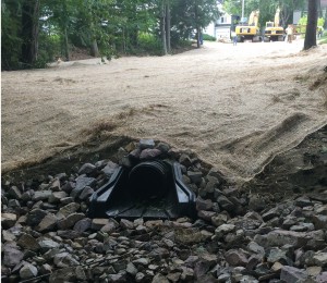 Stormwater outfall with riprap protection to prevent soil erosion. 